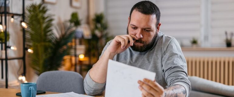 Man looking at debt consolidation options