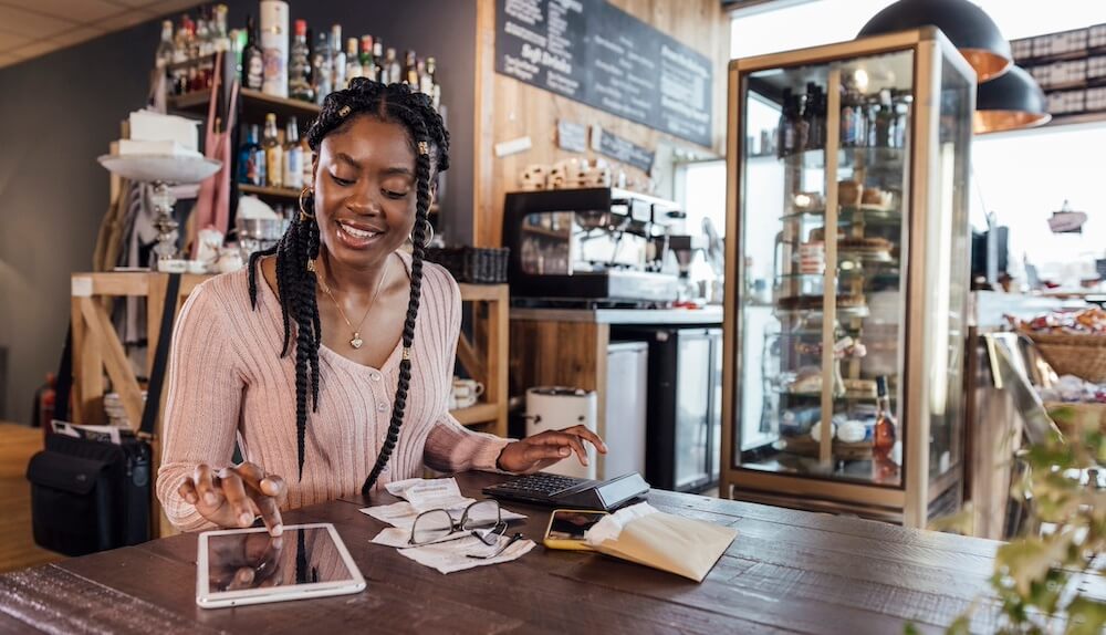 Female cafe owner opening a business savings account